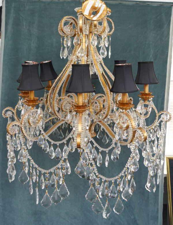 POSSIBLY RALPH LAUREN: A PAIR OF GILT METAL AND CUT GLASS EIGHT BRANCH CHANDELIERS (2)