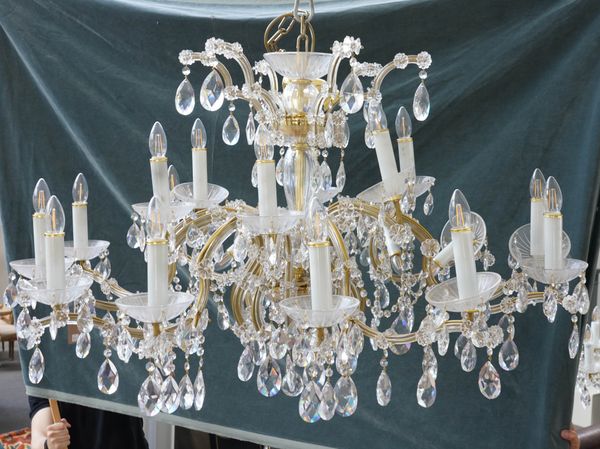 PROBABLY SWAROVSKI: A LARGE CUT GLASS EIGHTEEN BRANCH CHANDELIER