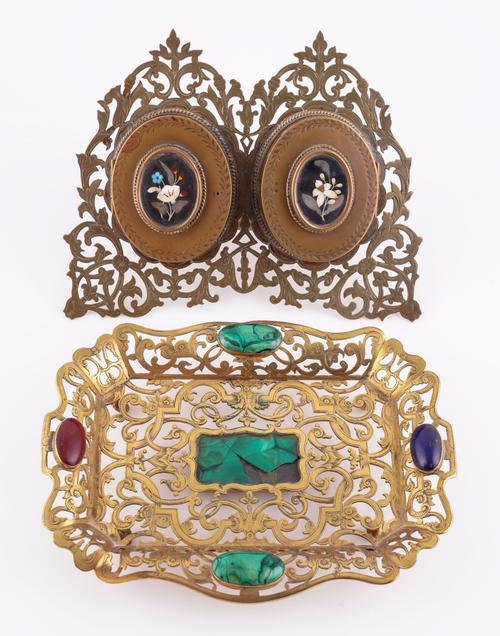 A VICTORIAN PIERCED BRASS AND PIETRA DURA INLAID DOUBLE PHOTOGRAPH FRAME, TOGETHER WITH AN ENGRAVED GILT-BRASS MALACHITE AND HARDSTONE MOUNTED TRAY (2)