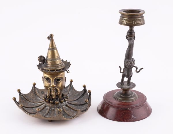 A REGENCY BRASS CHAMBER CANDLESTICK, TOGETHER WITH A GILT AND BRONZE EXAMPLE (2)