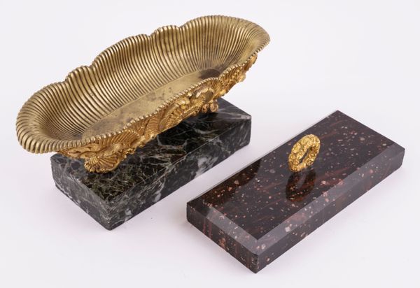 A SWEDISH BLYBERG PORPHYRY AND ORMOLU MOUNTED PAPERWEIGHT; TOGETHER WITH A CHARLES X GILT-METAL PEN TRAY (2)