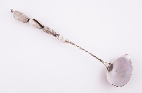 A FRENCH SILVER MOUNTED COWRIE SHELL LADLE