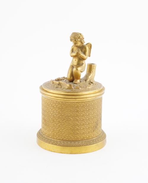 A RESTAURATION ORMOLU INKSTAND OR ECRIER WITH KNEELING CUPID MOUNTED COVER