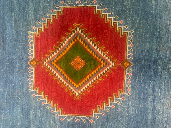 A MODERN ORANGE MOROCCAN CARPET