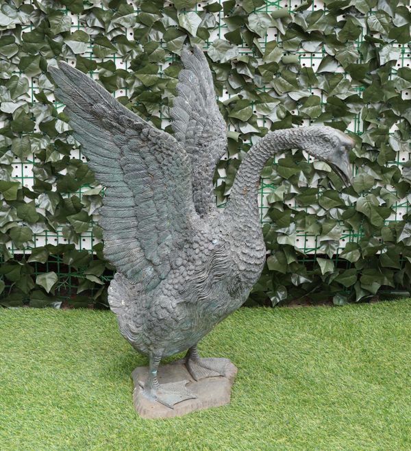 A CAST BRONZE FIGURE OF A STANDING SWAN