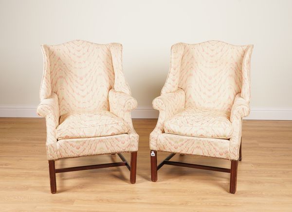 A PAIR OF GEORGE II STYLE SHAPED WINGBACK ARMCHAIRS (2)