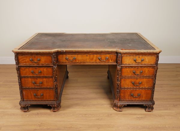 AN 18TH CENTURY STYLE CARVED MAHOGANY INVERTED BREAKFRONT PEDESTAL PARTNER’S DESK