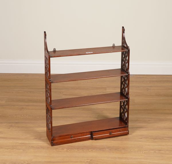 A SET OF MAHOGANY FRET CARVED WATERFALL HANGING FOUR TIER SHELVES