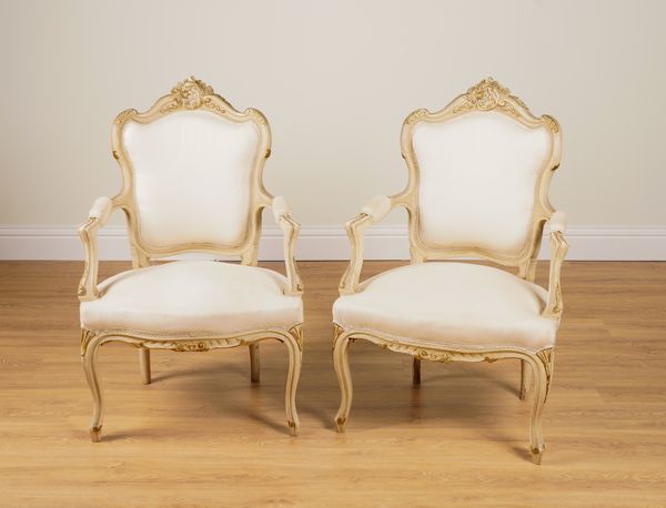 A PAIR OF PARCEL GILT CREAM PAINTED OPEN ARMCHAIRS OF 18TH CENTURY VENETIAN STYLE (2)