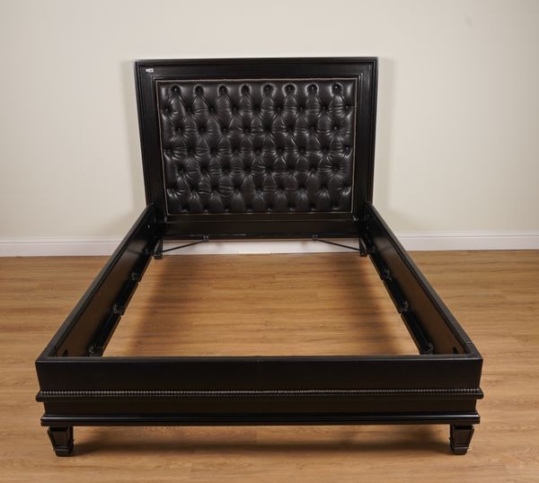 RALPH LAUREN; A NEWCOMB KING SIZE BED WITH STUDDED BLACK LEATHER UPHOLSTERED HEADBOARD