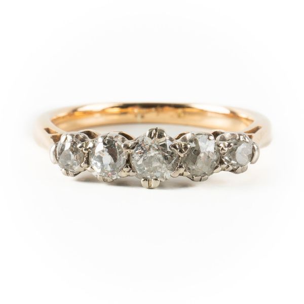 A GOLD AND DIAMOND FIVE STONE RING