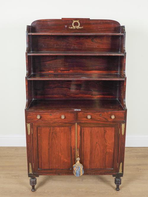 A REGENCY ROSEWOOD WATERFALL BOOKCASE