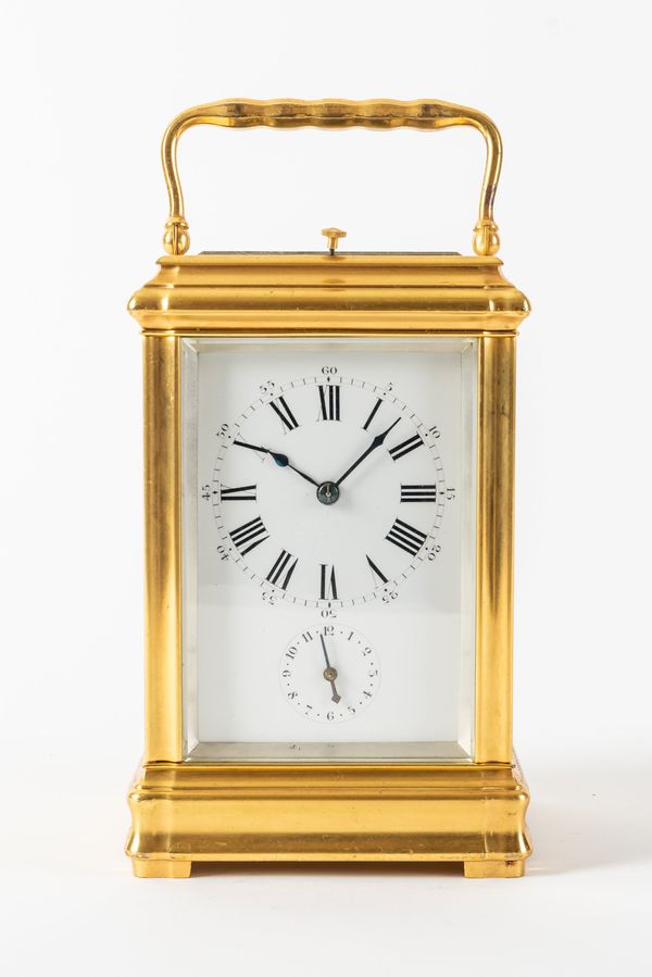 A RARE FRENCH GILT BRASS MID SIZE GORGE CASED GRANDE AND PETITE SONNERIE STRIKING ON FOUR GONGS CARRIAGE CLOCK