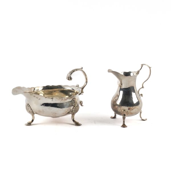 A GEORGE III SILVER SAUCEBOAT AND A GEORGE III SILVER CREAM JUG (2)