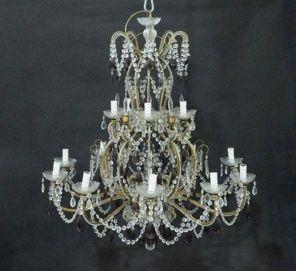 AN ITALIAN GILT-METAL AND GLASS MOUNTED CARTOUCHE SHAPED FIFTEEN LIGHT CHANDELIER