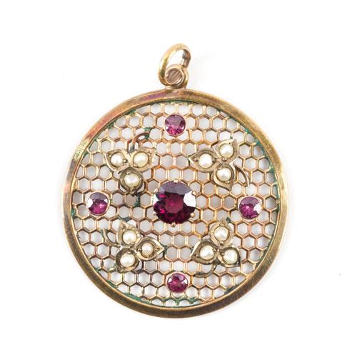 A GOLD, GARNET AND SEED PEARL CIRCULAR PENDANT