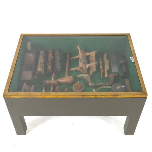 A COLLECTION OF CARPENTRY TOOLS MOUNTED IN A GLAZED LOW TABLE (QTY)