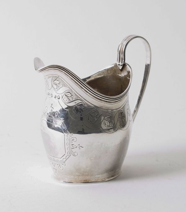 A GEORGE III SILVER CREAM JUG