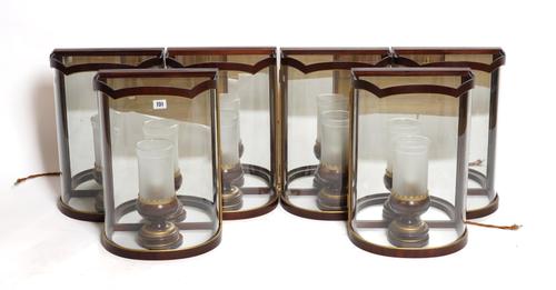 A SET OF SIX MAHOGANY AND GLASS BOW FRONT HURRICANE STYLE WALL LIGHTS WITH GILT DECORATION (6)