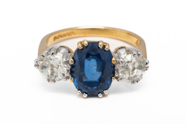 A SAPPHIRE AND DIAMOND THREE STONE RING (2)