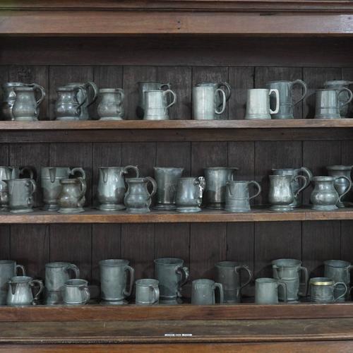 A COLLECTION OF ENGLISH PEWTER QUART MEASURE AND PINT TANKARDS (46)