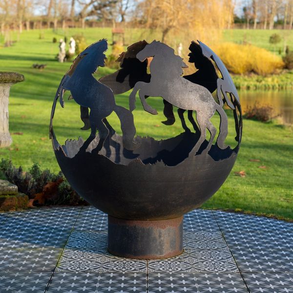 A GLOBULAR CAST METAL FIRE PIT