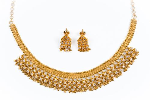 A MATCHING NECKLACE AND EARRINGS