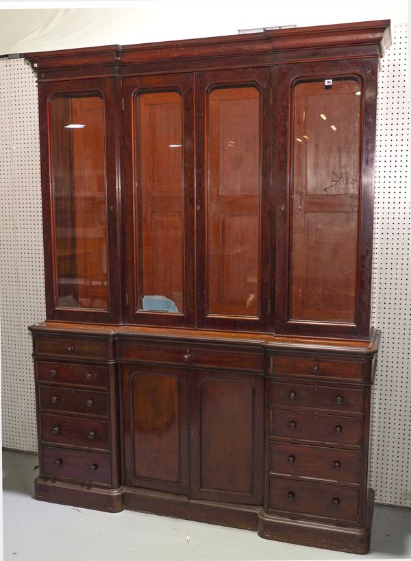 A VICTORIAN MAHOGANY FOUR DOOR BREAKFRONT BOOKCASE