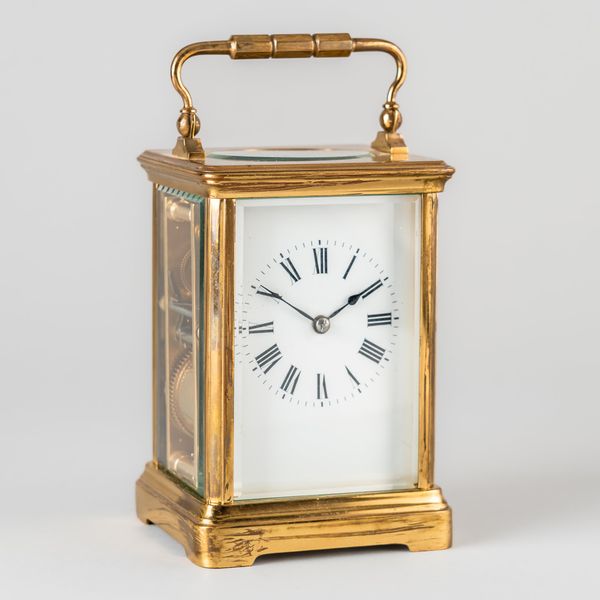 A FRENCH BRASS STRIKING LEVER CARRIAGE CLOCK