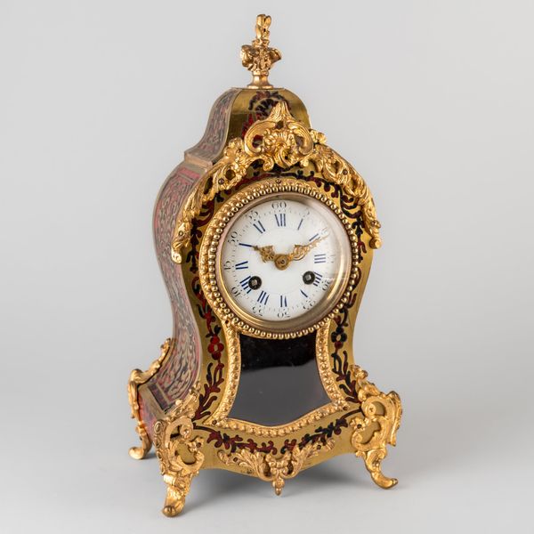 A FRENCH GILTMETAL-MOUNTED BOULLE MANTEL CLOCK