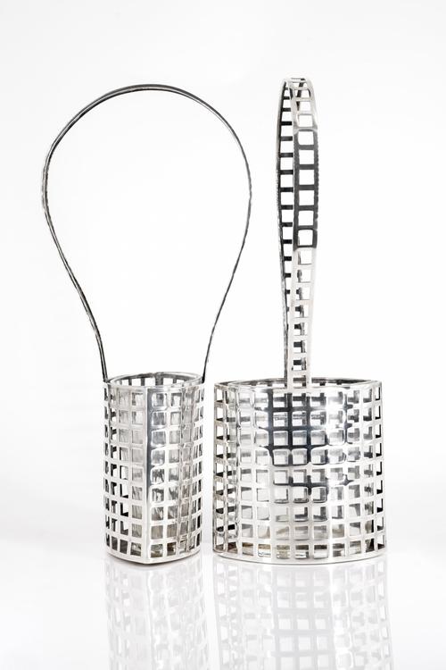 JOSEF HOFFMANN FOR WIENER WERKSTATTE: A PAIR OF SECESSIONIST 'GITTERWERK' SILVER FLOWER BASKETS