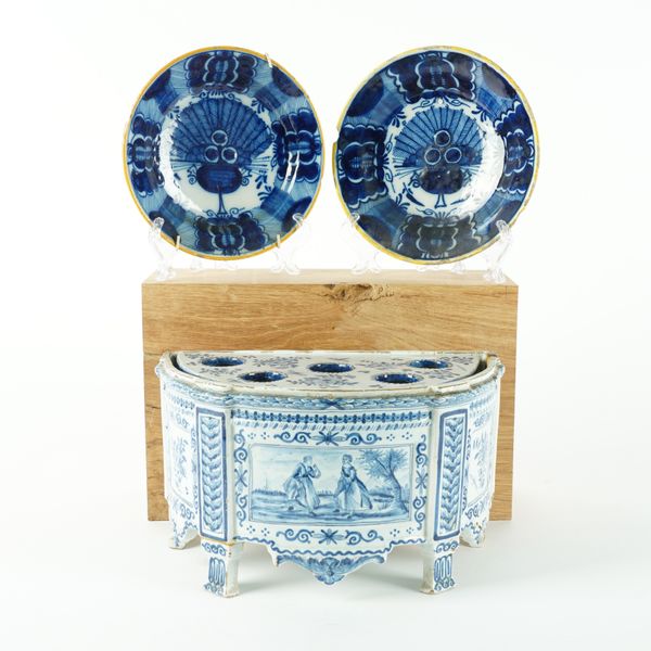 A DUTCH DELFT DEMI-LUNE BOUGH POT AND A COVER (4)