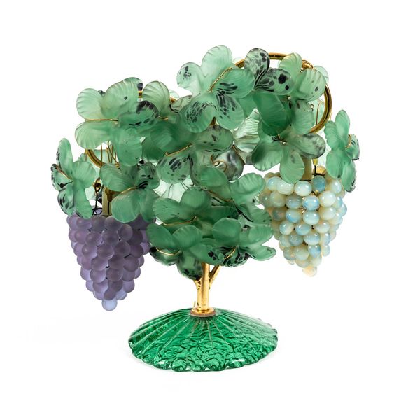 IN THE MANNER OF TOSO CESARE FOR MURANO; A COLOURED GLASS TABLE LAMP MODELLED AS FRUITING GRAPE VINES