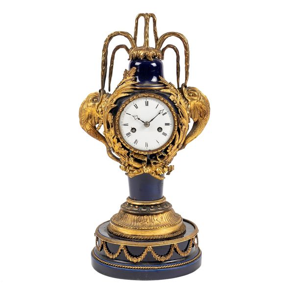 A FRENCH ORMOLU AND BLUE SEVRES-STYLE PORCELAIN MANTEL CLOCK