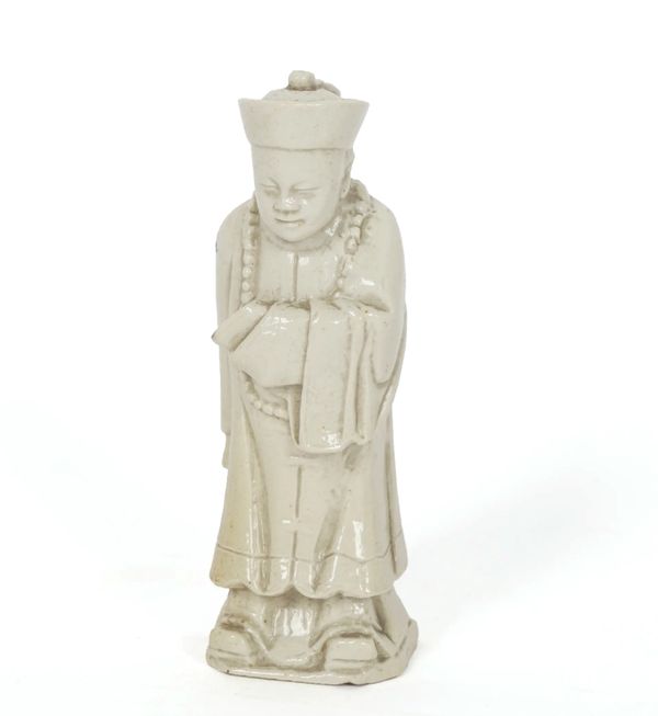 AN UNUSUAL SMALL SALTGLAZED STONEWARE FIGURE OF A CHINESE MANDARIN