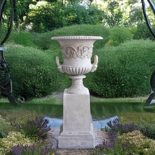 A 20TH CENTURY PATINATED PLASTER TWIN-HANDLED URN