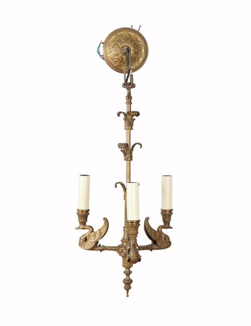 AN EMPIRE STYLE GILT-BRONZE THREE LIGHT CHANDELIER