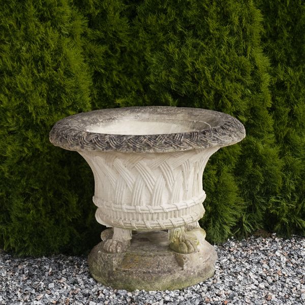 A RECONSTITUTED STONE GARDEN URN