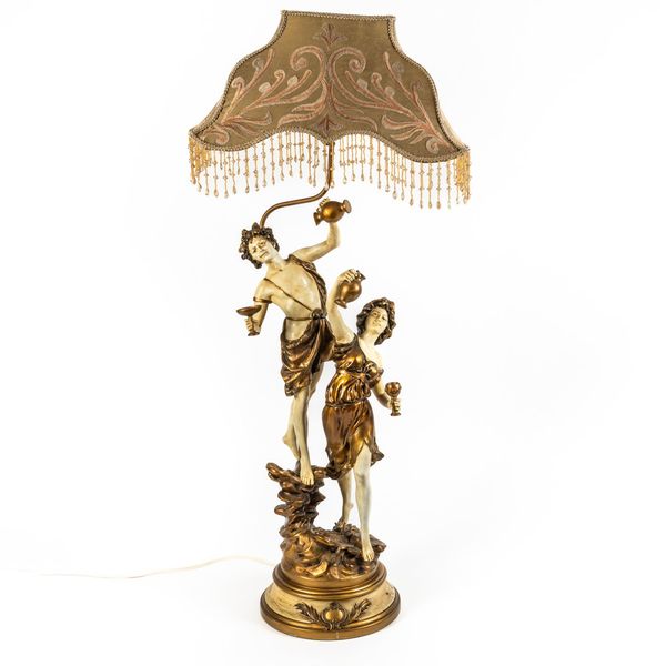 L & F MOREAU; A FIGURAL POLYCHROME PAINTED METAL FIGURAL TABLE LAMP OF BACCHUS AND MUSE