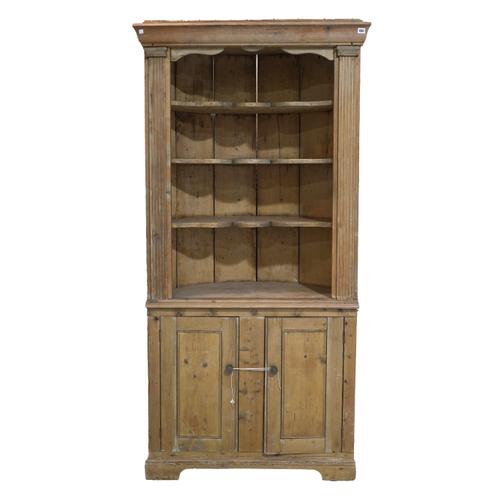 AN 18TH CENTURY AND LATER PINE FLOORSTANDING CORNER CUPBOARD