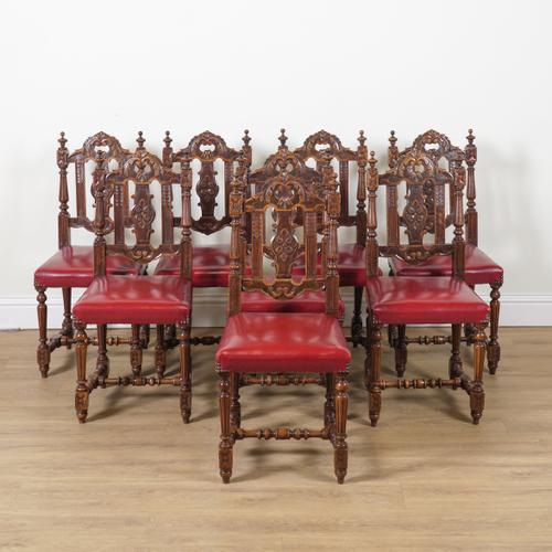 A SET OF EIGHT 19TH CENTURY CARVED WALNUT DINING CHAIRS (8)