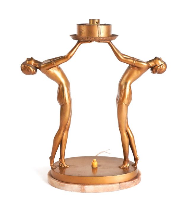 AN ART DECO GILT-METAL FIGURAL TABLE LAMP