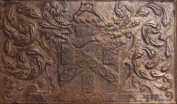 A CAST-IRON FIREBACK WITH THE ARMS OF THE WORSHIPFUL COMPANY OF IRONMONGERS
