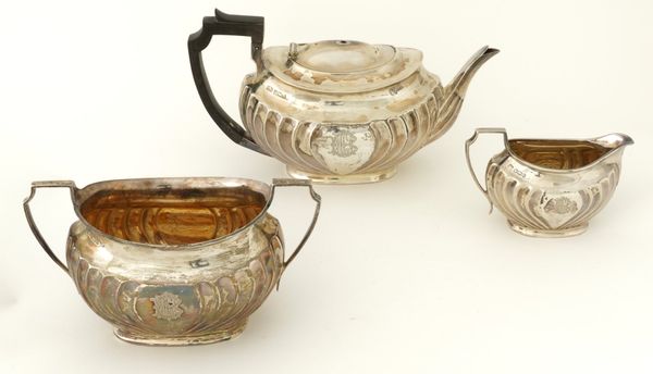 A SILVER THREE PIECE TEA SET