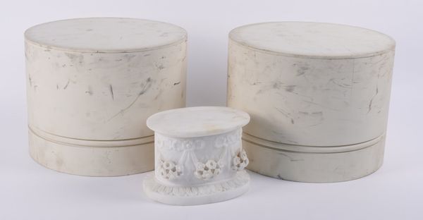 A RELIEF CARVED WHITE MARBLE OVAL PLINTH (3)