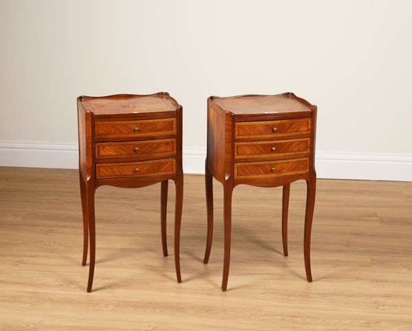 A PAIR OF FRENCH KINGWOOD THREE DRAWER BEDSIDE TABLES (2)