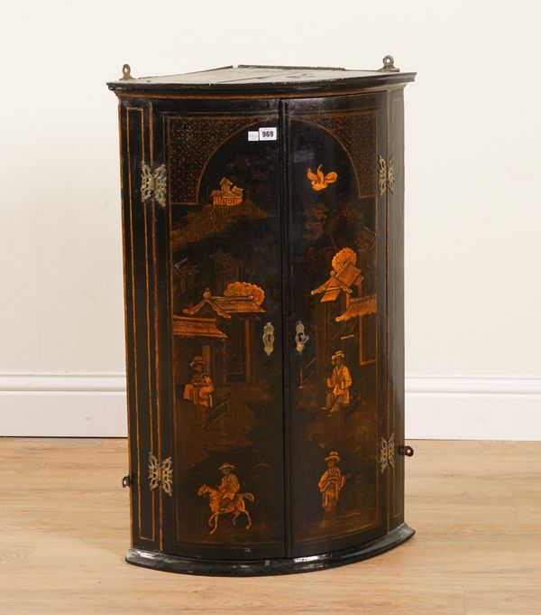 AN 18TH CENTURY BLACK LACQUER CHINOISERIE DECORATED BOWFRONT HANGING TWO DOOR CORNER CABINET