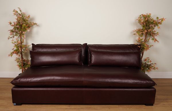 A LARGE BROWN LEATHER SOFA
