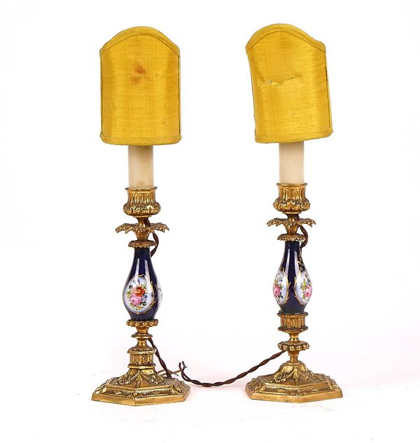 TWO SIMILAR FRENCH GILT-METAL MOUNTED PORCELAIN CANDLESTICKS ADAPTED TO TABLE LAMPS