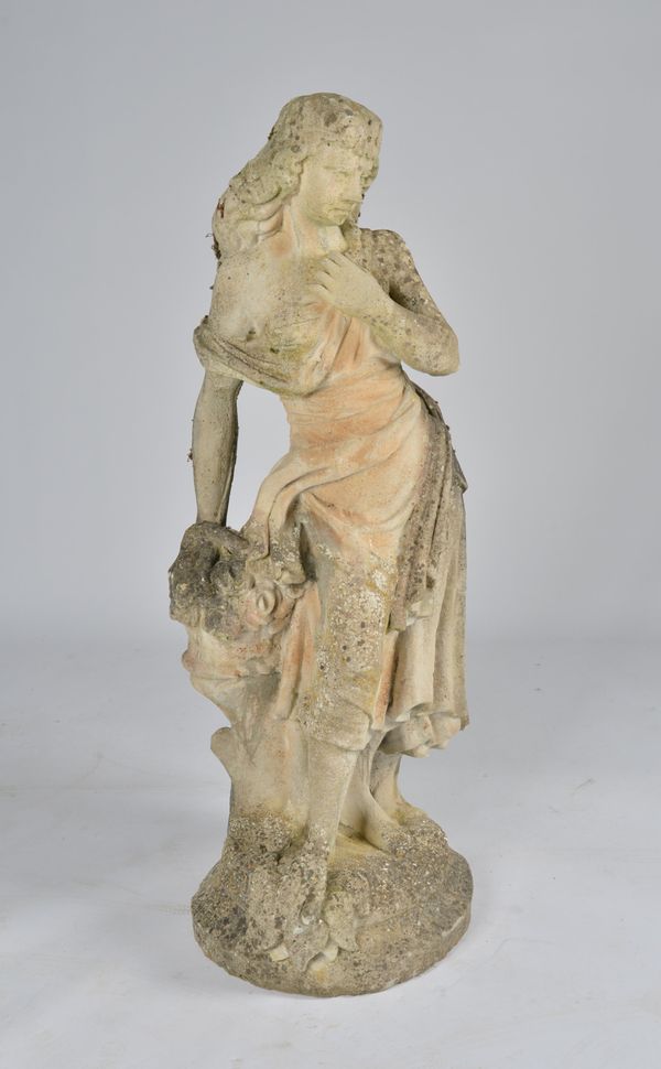 A RECONSTITUTED STONE FIGURE GROUP OF A STANDING LADY